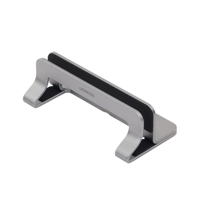 Soporte Vertical para Laptop / Adecuado para escritorio / Anchura Ajustable (12-26mm) / Amplia compatibilidad / Anti-Arañazos / Anti-Deslizante /Ajustable Mediante Tornillos / Color Plata / Aluminio + Silicona